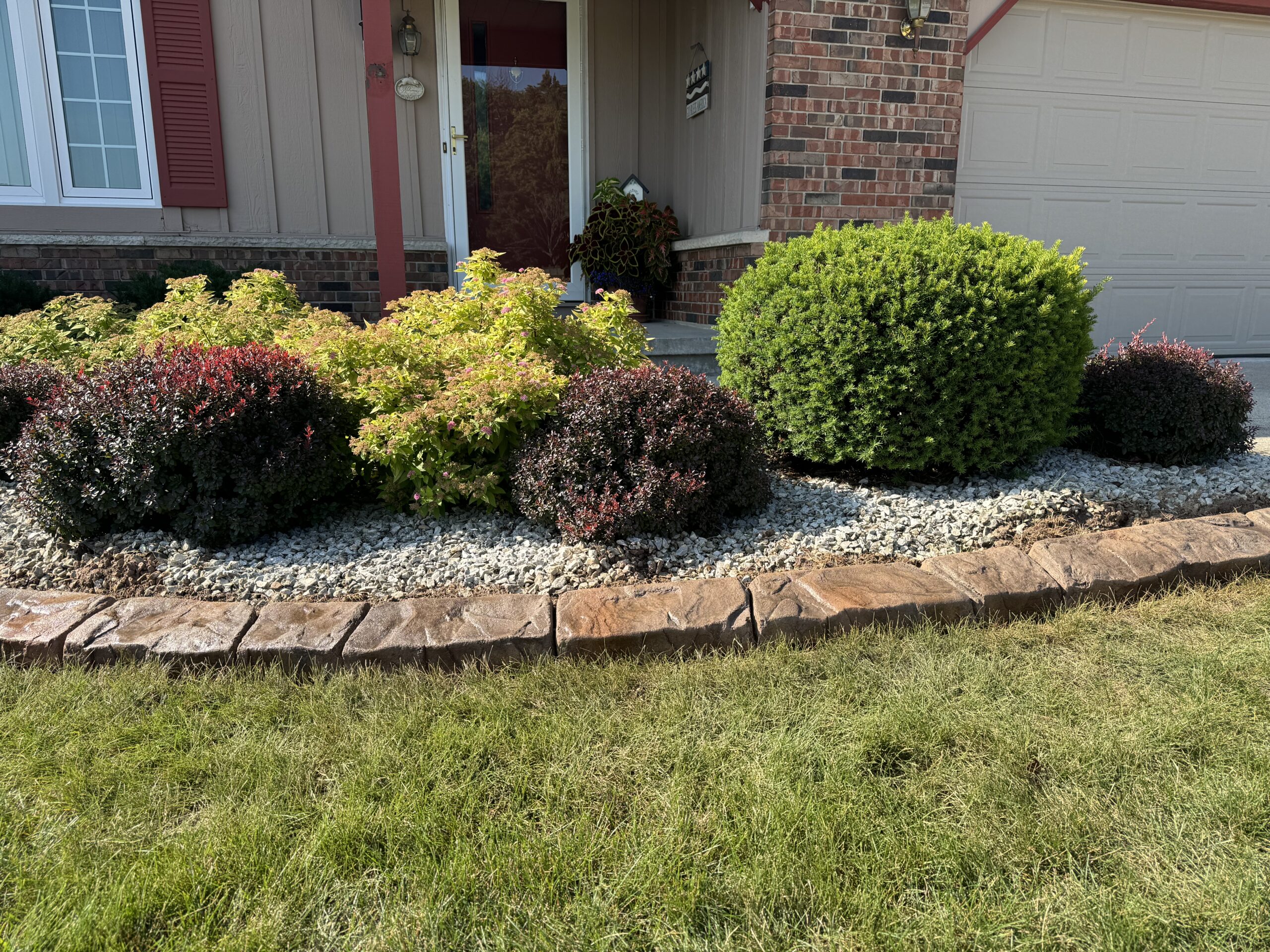 Concrete curbing vs plastic edging